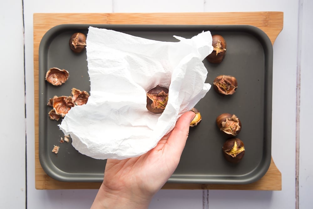 Preparing the freshly roasted chestnuts 