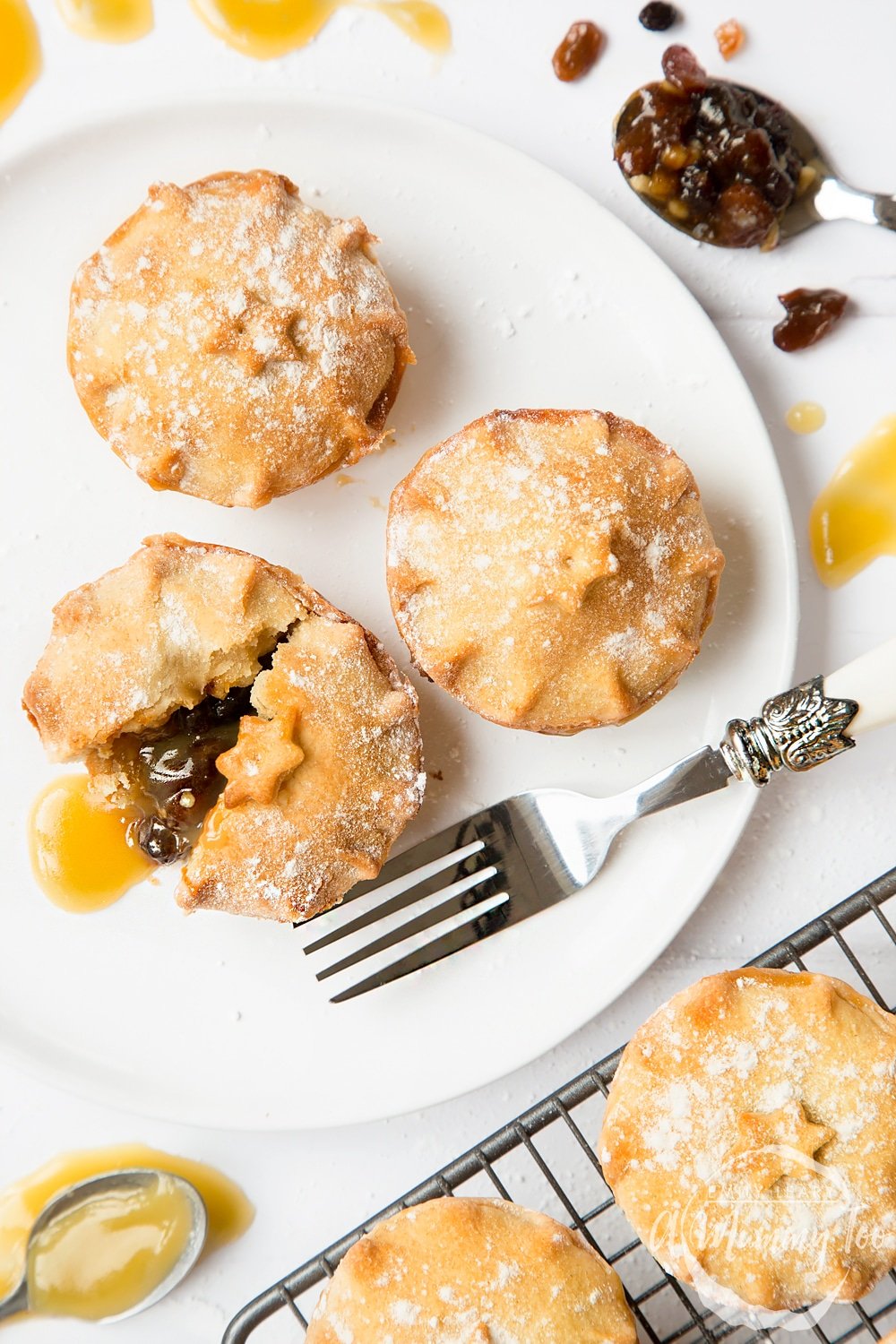 Delicious salted caramel mince pies served on a plate, alongside salted caramel sauce