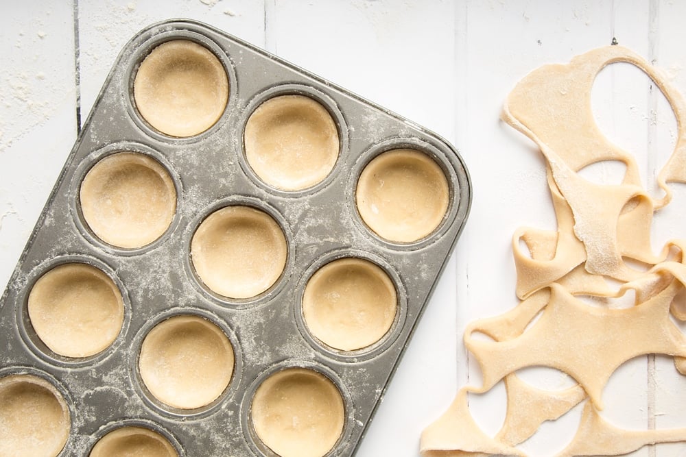 Place the pastry into a muffin tray, ready to add the salted caramel mince pie filling