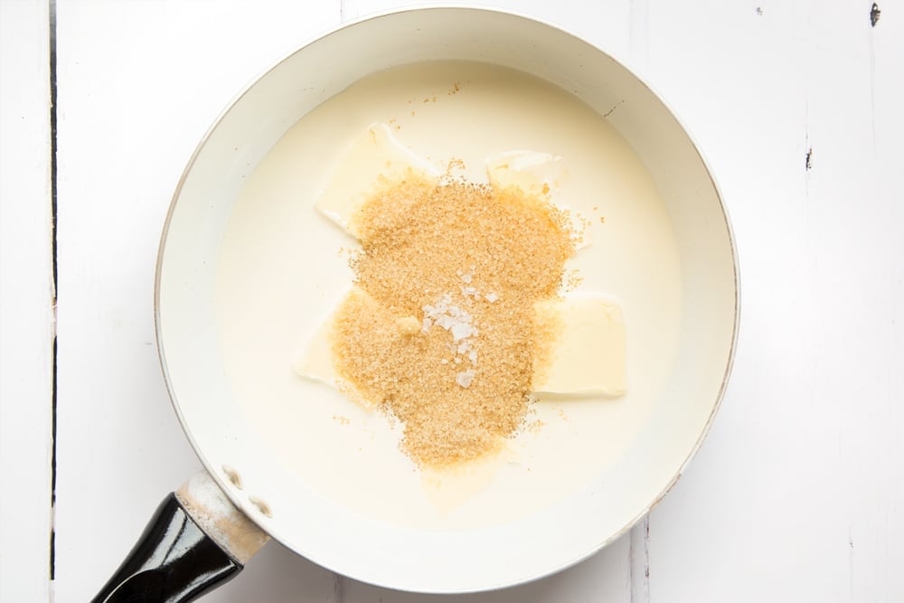 Adding the salted caramel sauce ingredients into a pan