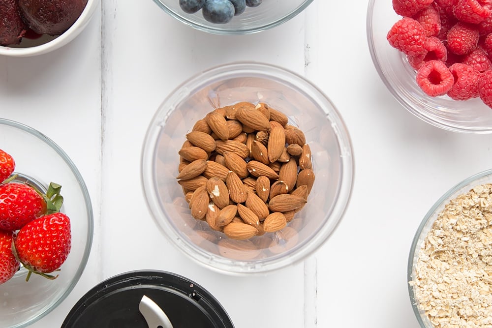 Preparing almonds for the vegan fruit and nut smoothie bowl