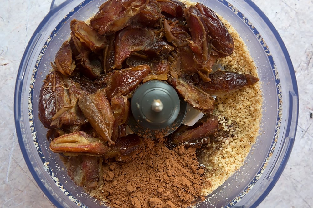 Mixing the healthier chocolate bars ingredients together in a food processor