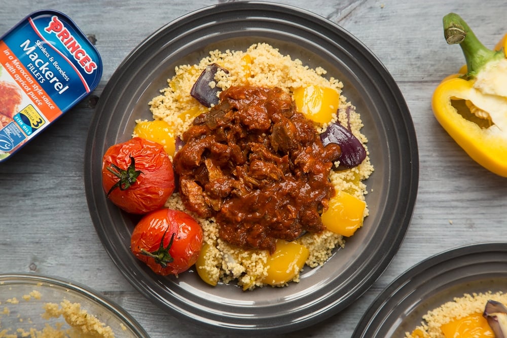 Grilled tomatoes finish off the Moroccan-style mackerel vegetable couscous dish