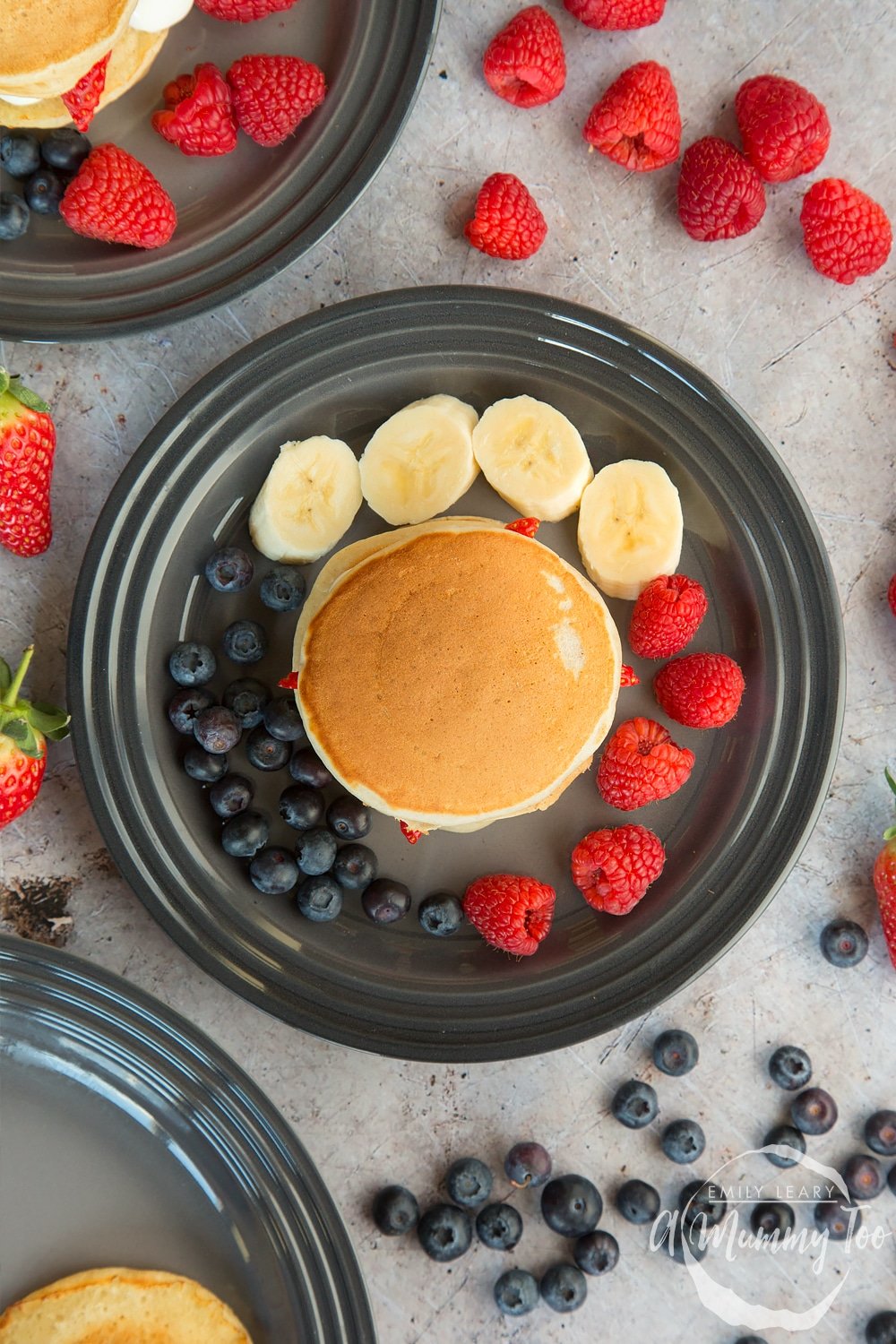 Surround your fruity pancake stack with fresh fruit and serve