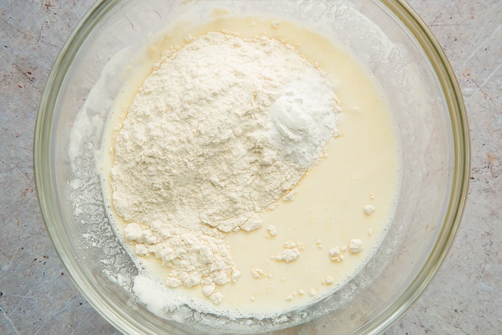 Flour and baking powder are added to the pancake mix
