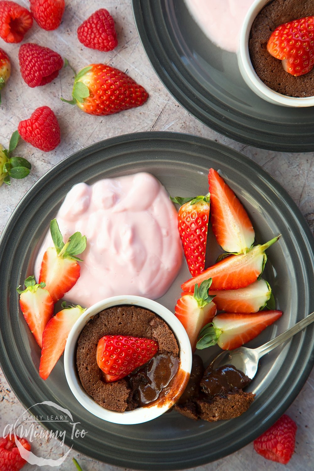 A strawberry hot chocolate pudding, shown alongside Onken strawberry yogurt and fresh strawberries