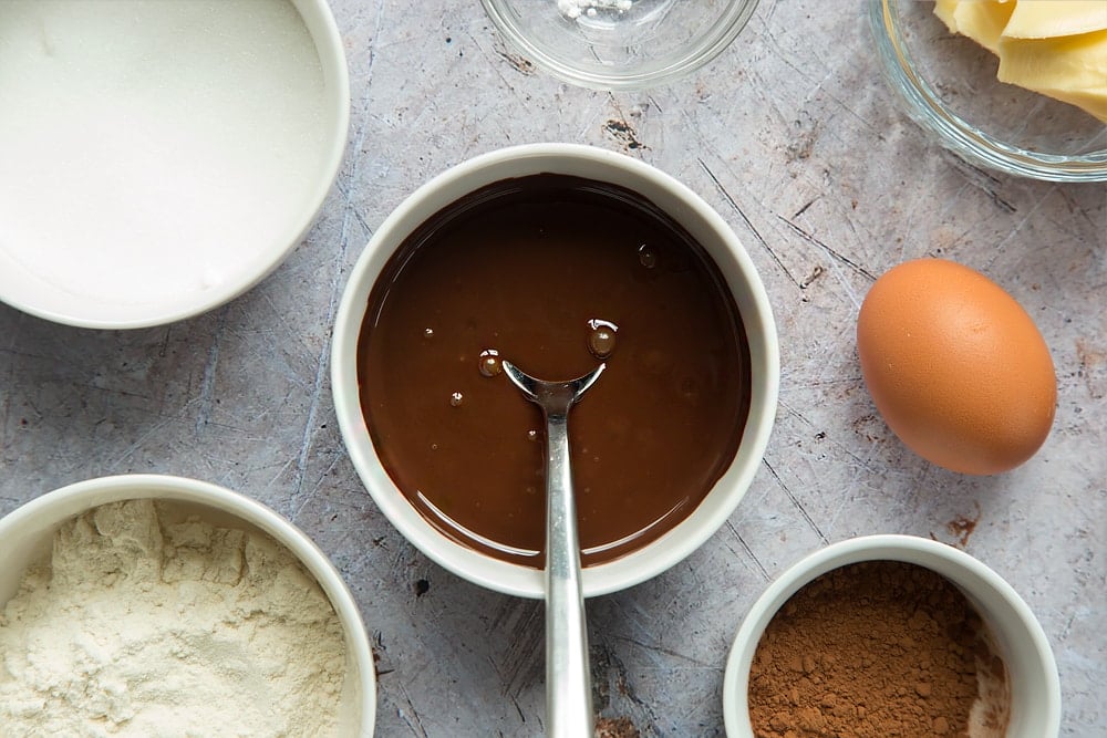 Melted dark chocolate, ready to create the mix for these strawberry hot chocolate puddings