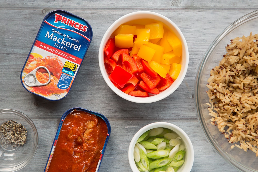 Ingredients for the spicy tomato mackerel with rice - Princes mackerel fillets in a spicy tomato sauce, chopped peppers, rice, spring onions and seasoning.