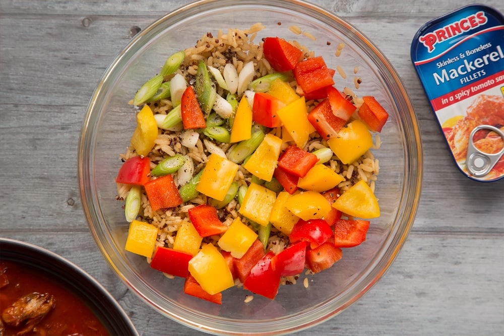 Mixed vegetables are added to the rice and seasoned