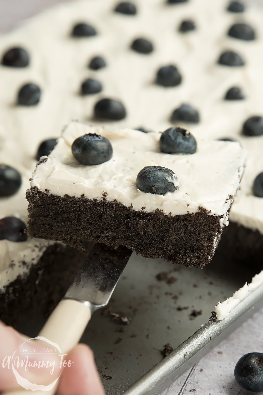 Sliced, freshly baked black velvet sheet cake - ready to serve!