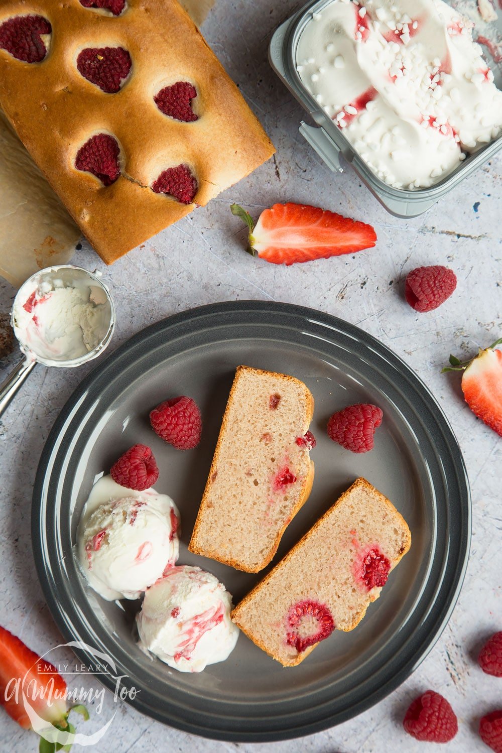 Berry Eton Mess ice cream loaf topped with a handful of raspberries