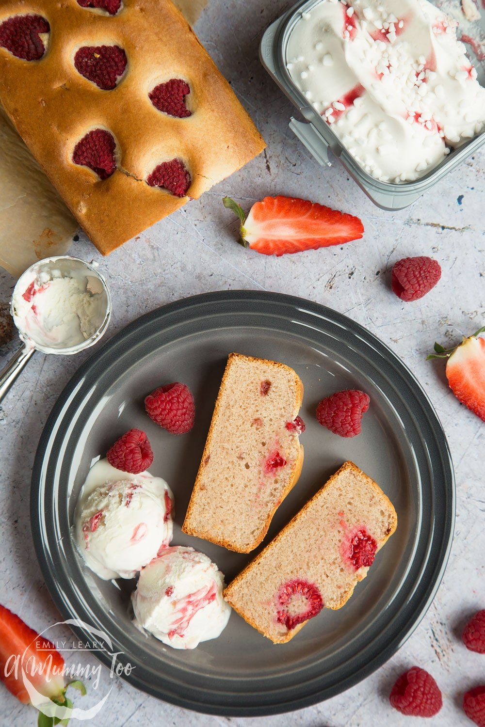 Berry Eton Mess ice cream loaf topped with a handful of raspberries