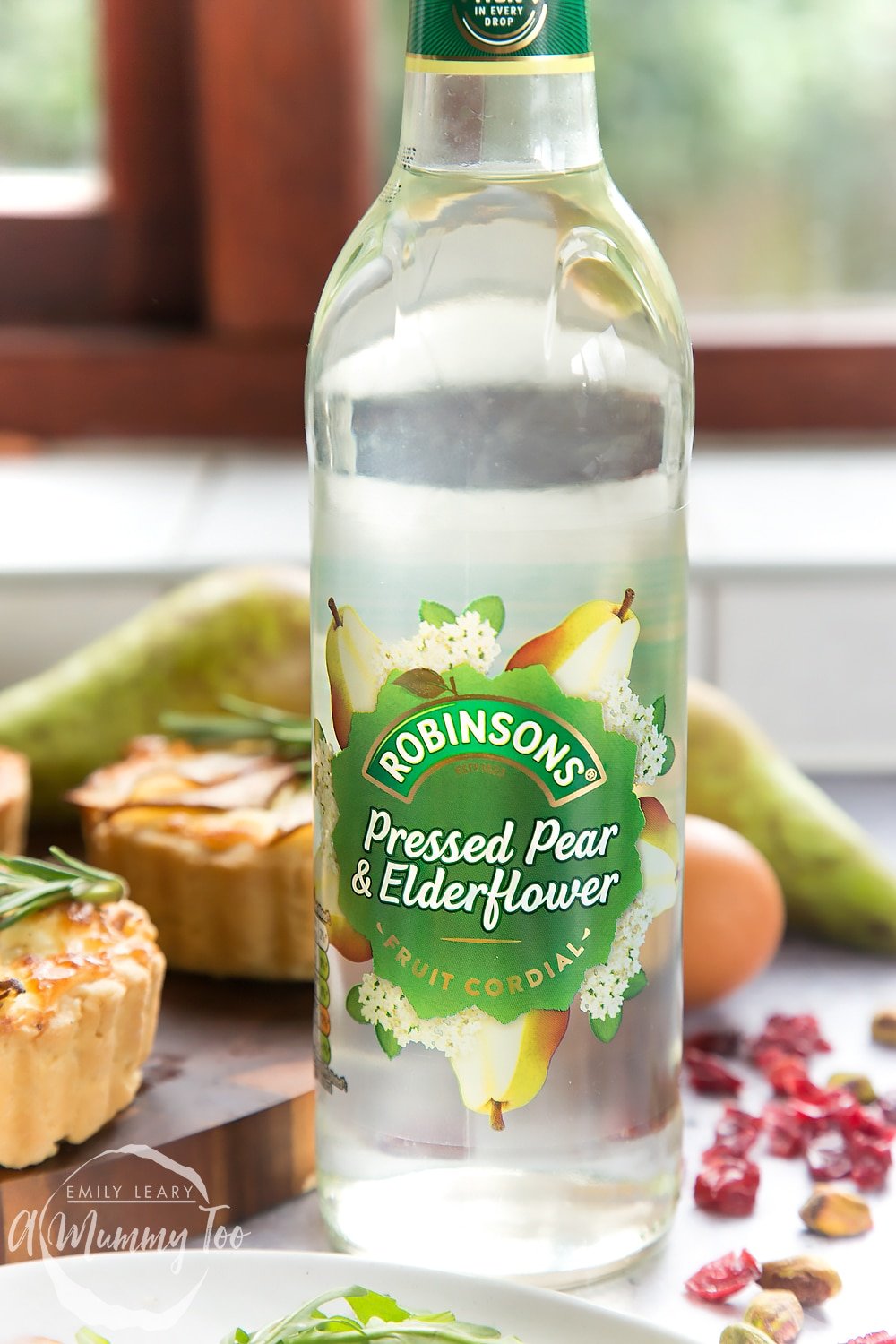 Robinsons pressed pear and elderflower fruit cordial, shown alongside the rosemary goat's cheese tarts