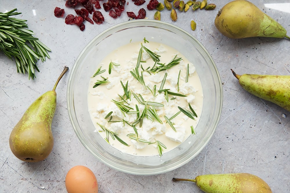 Rosemary and goat's cheese is added to the mixture