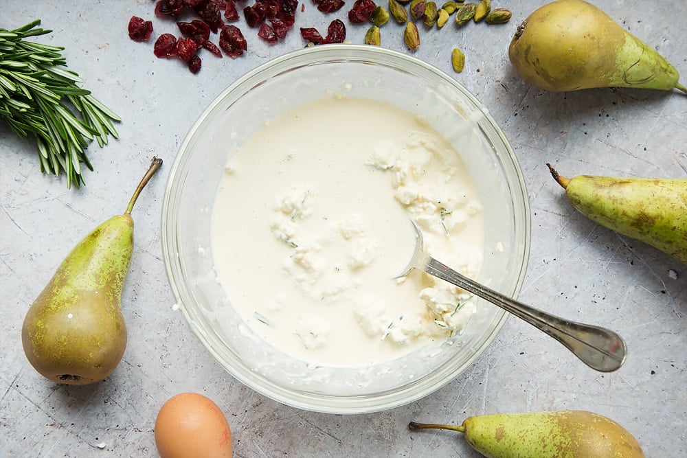 The rosemary and goat's cheese is stirred in to create the tart filling