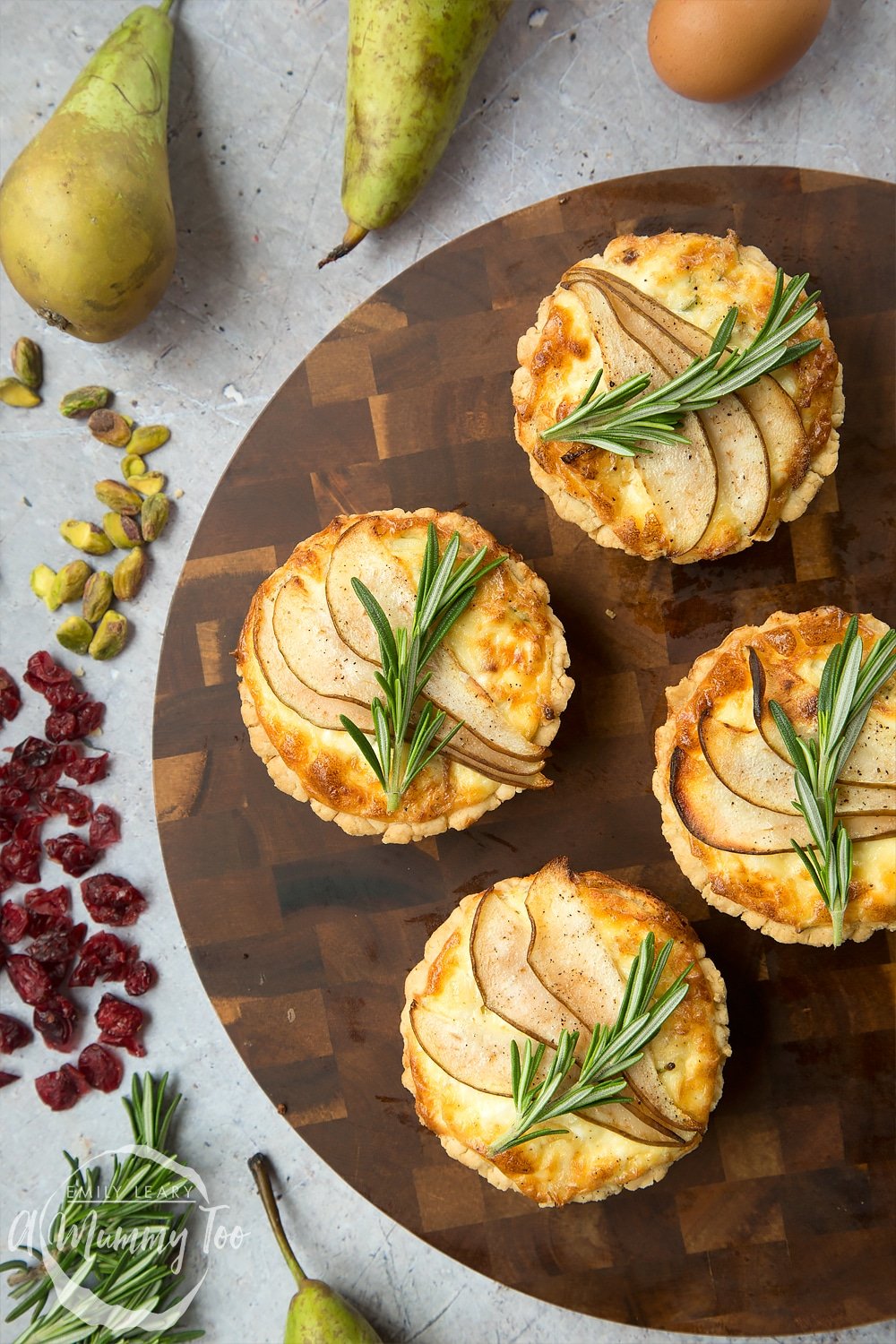 Freshly baked rosemary goat's cheese tarts, ready to serve at your Summer party