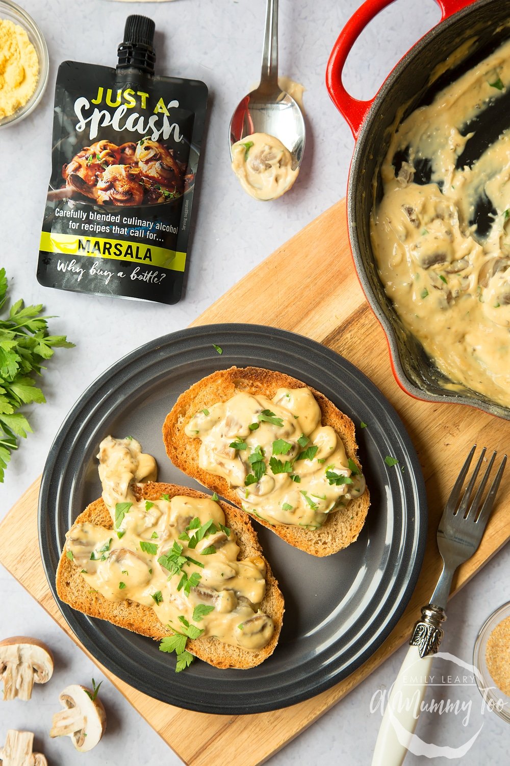 Creamy marsala mushrooms on toast, topped with a sprinkle of parsley
