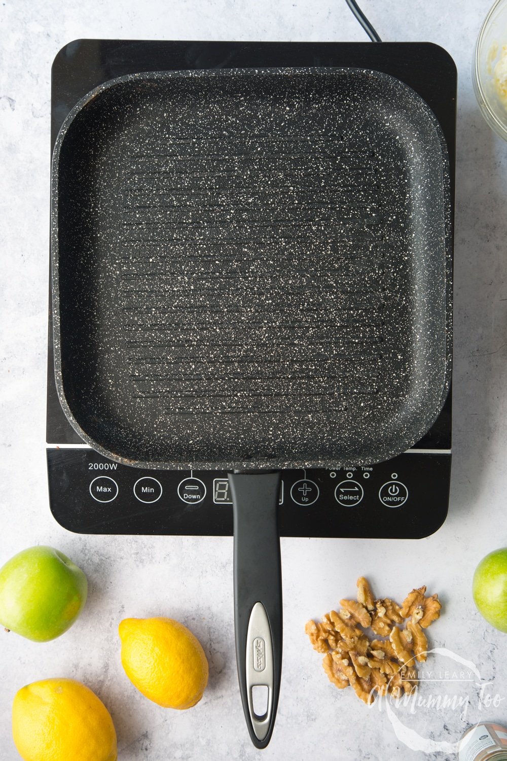 A griddle pan being heated on an induction hob.