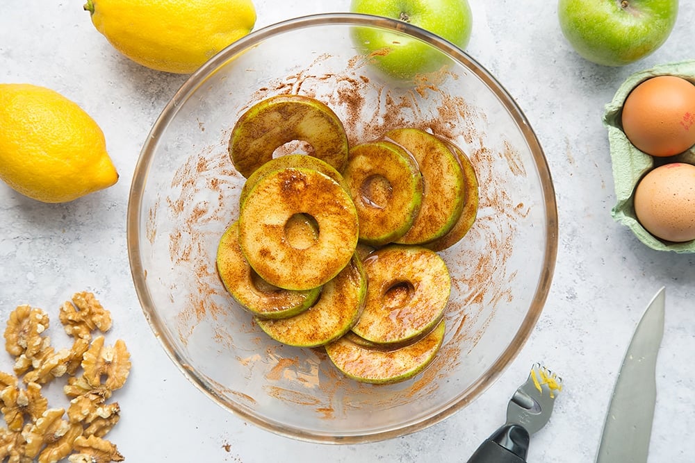 Sliced apple coated in the cinnamon and honey mixture