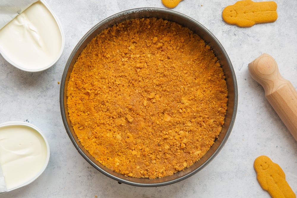 Overhead shot of biscuits crust in a large cake tin