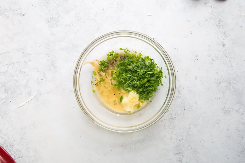 Lemon tahini sauce ingredients in a glass bowl