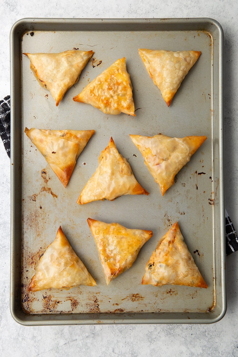 Freshly baked olive and sun-dried tomato filo parcels