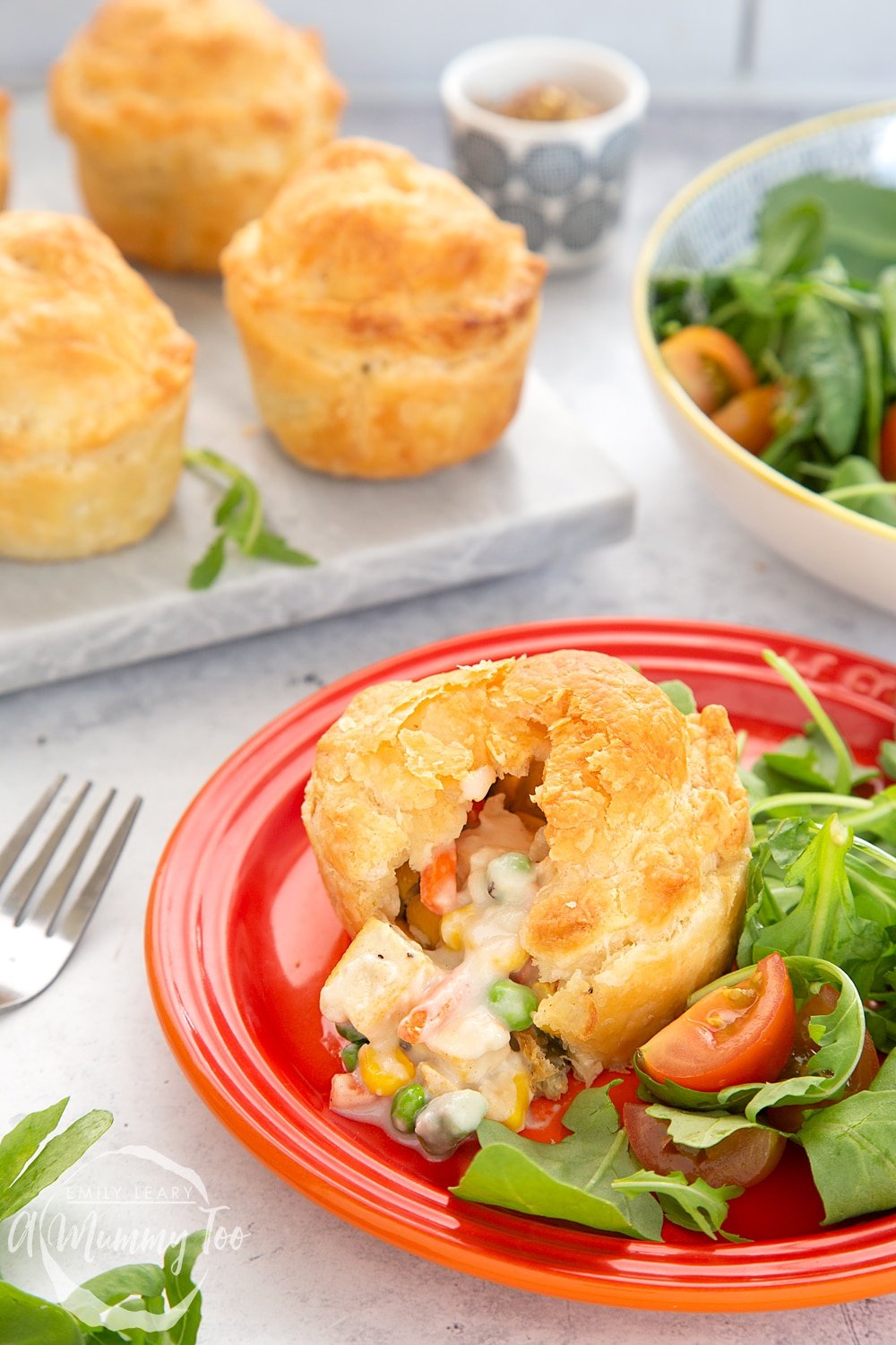 Creamy tofu and vegetable vegan mini pies served on a plate with salad