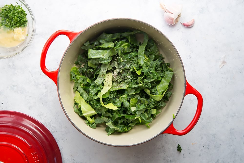 Garlic, spring greens and kale are added to the pan