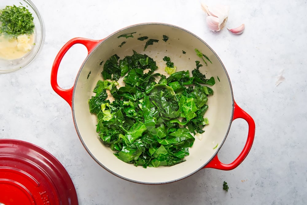 Gently frying spring greens in a pan