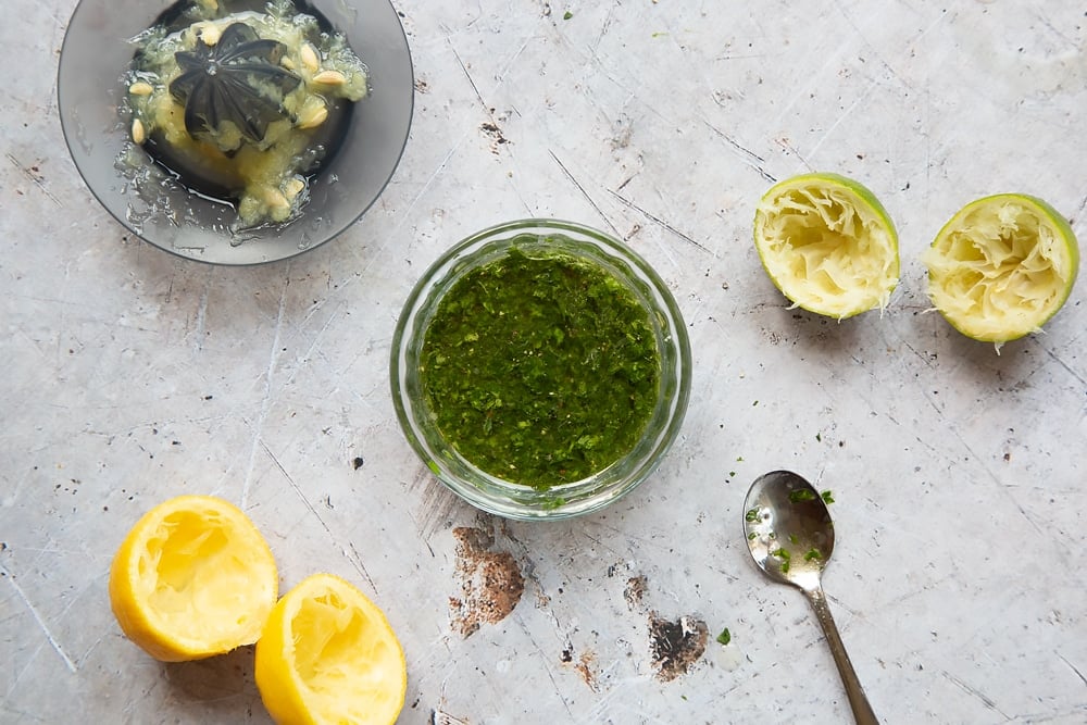 Mixing the herby citrus dressing for the lamb steak and veg sheet pan meal