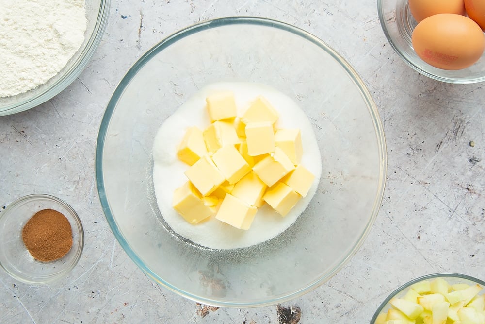 Cubed butter and sugar in a bowl 