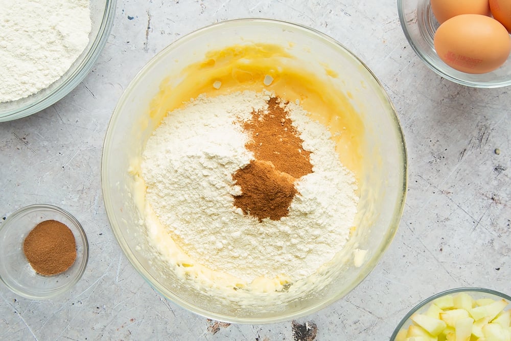 Flour and cinnamon are added to the cake mix 