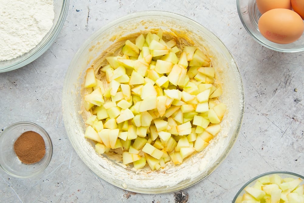 Chopped apples are added to the cake mix 