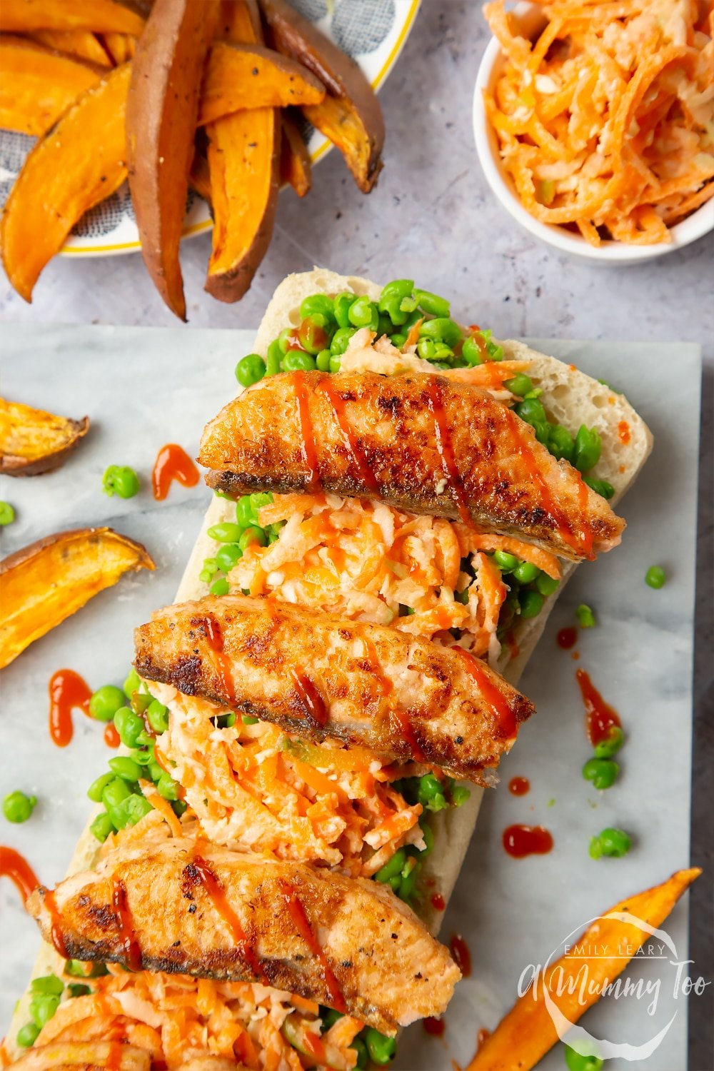 A healthier fish finger sarnie served with sweet potato wedges  