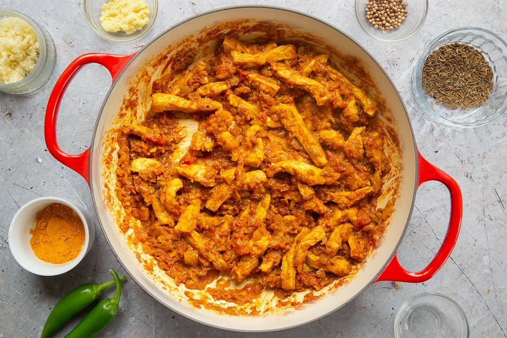 Cooking coconut-pork curry in a pan 