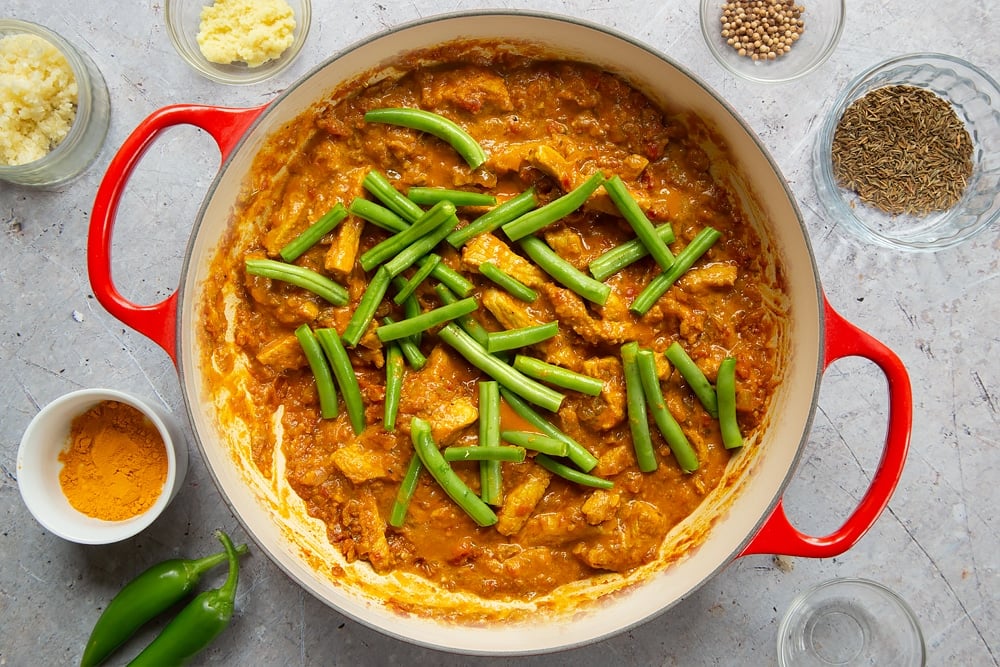 Adding trimmed beans to the curry