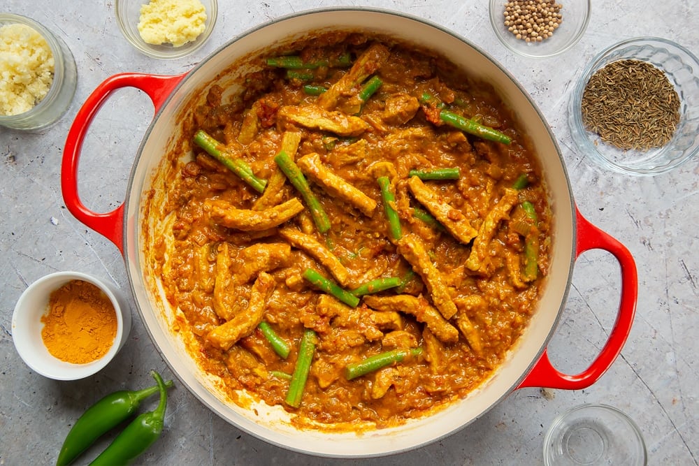 Cooking Keralan Pandi, a South Indian coconut-pork curry in a pan 