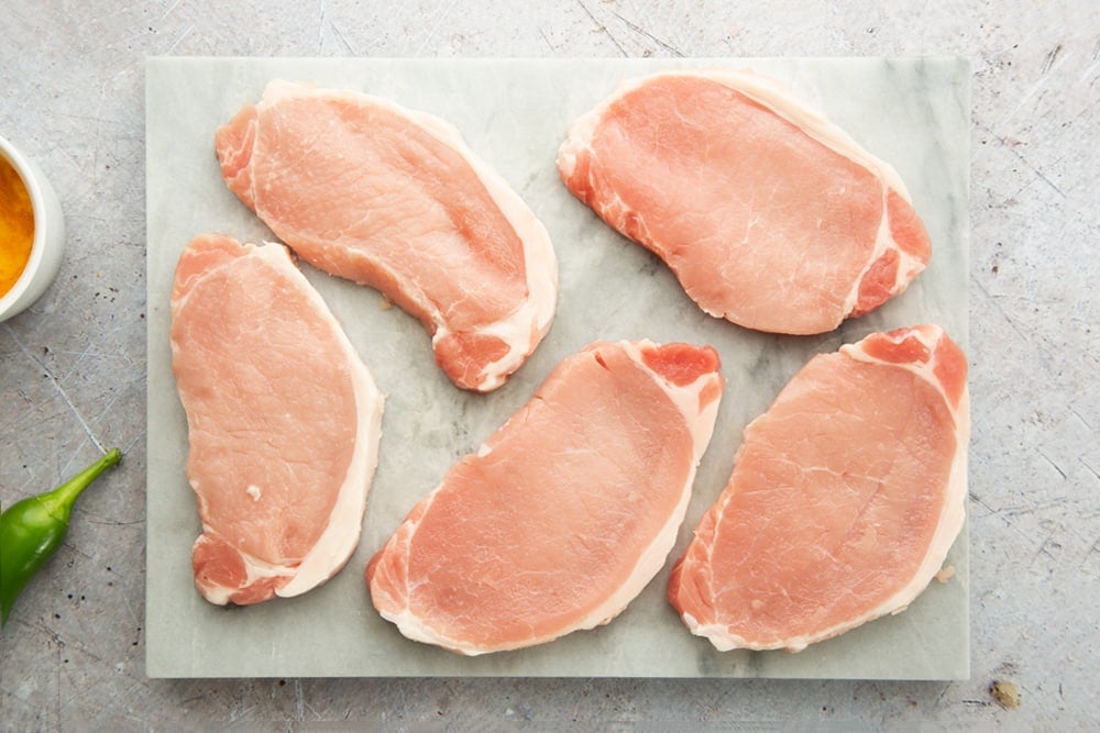 Preparing the pork to make this coconut-pork curry