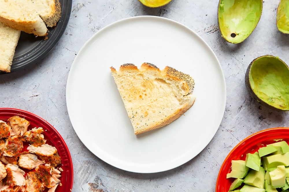 Place a lightly toasted slice of bread onto the plate ready for the sweet chilli salmon
