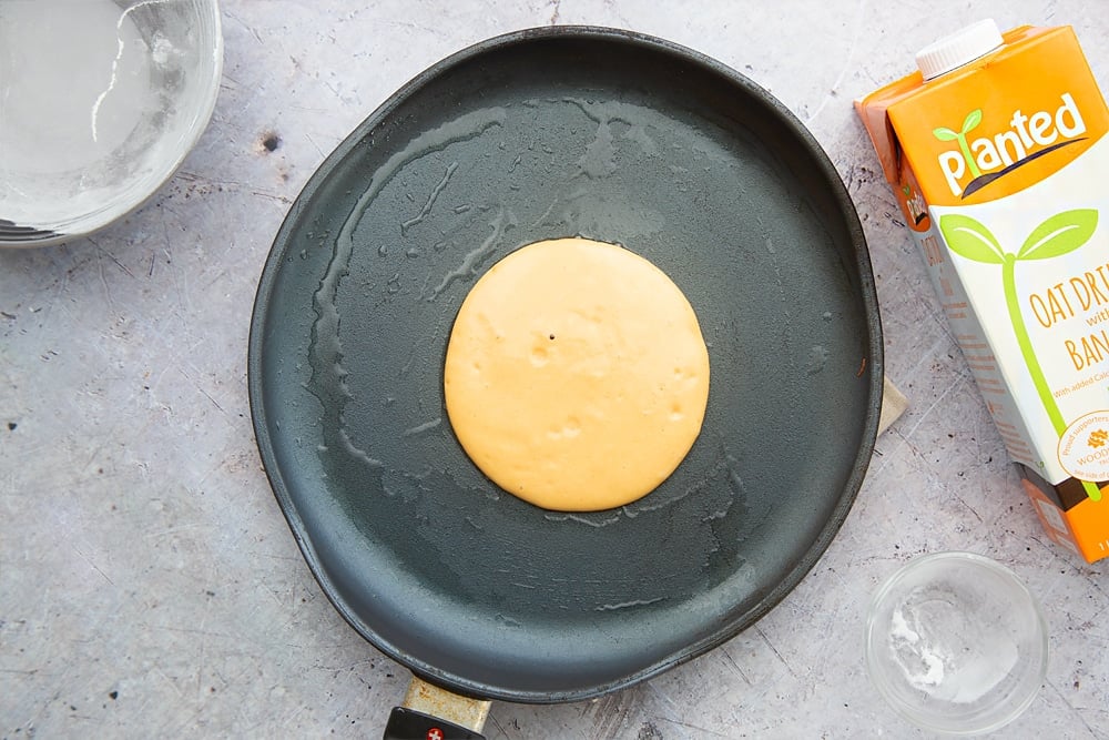 A sweet potato pancake in a frying pan