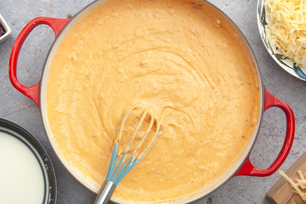 Harissa mac and cheese sauce in a pan