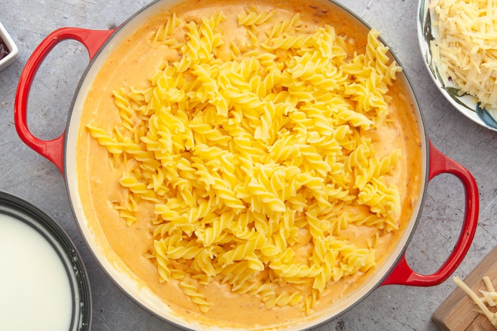 Adding partially cooked pasta to the cheese sauce