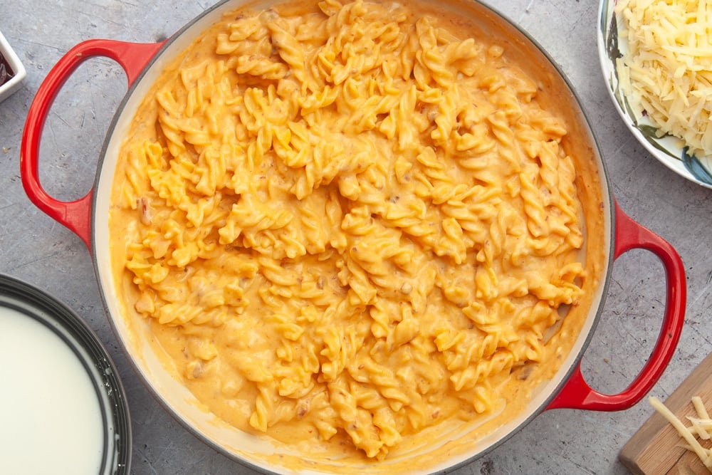 Pasta coated with cheese sauce, ready to bake in the oven