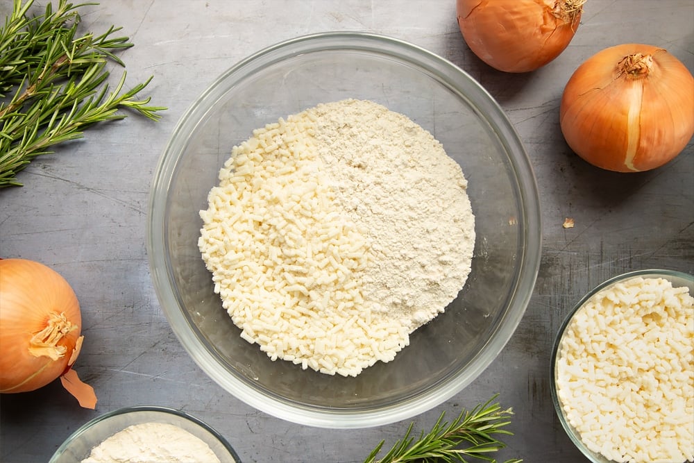 Onions, suet and flour, salt and pepper in a mixing bowl