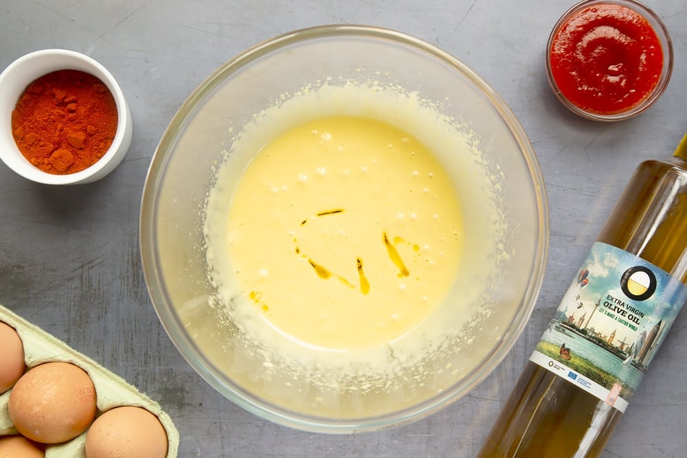 Olive oil is added to the patatas bravas sauce