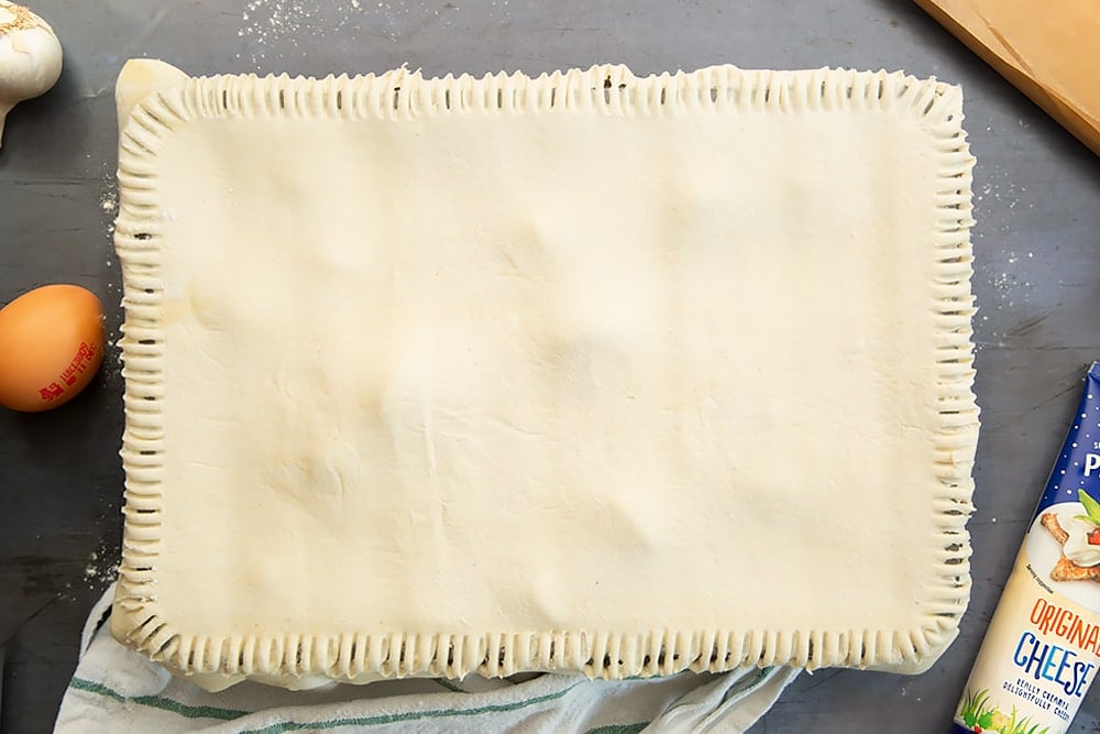 Press fork around the edges of the puff pastry to seal