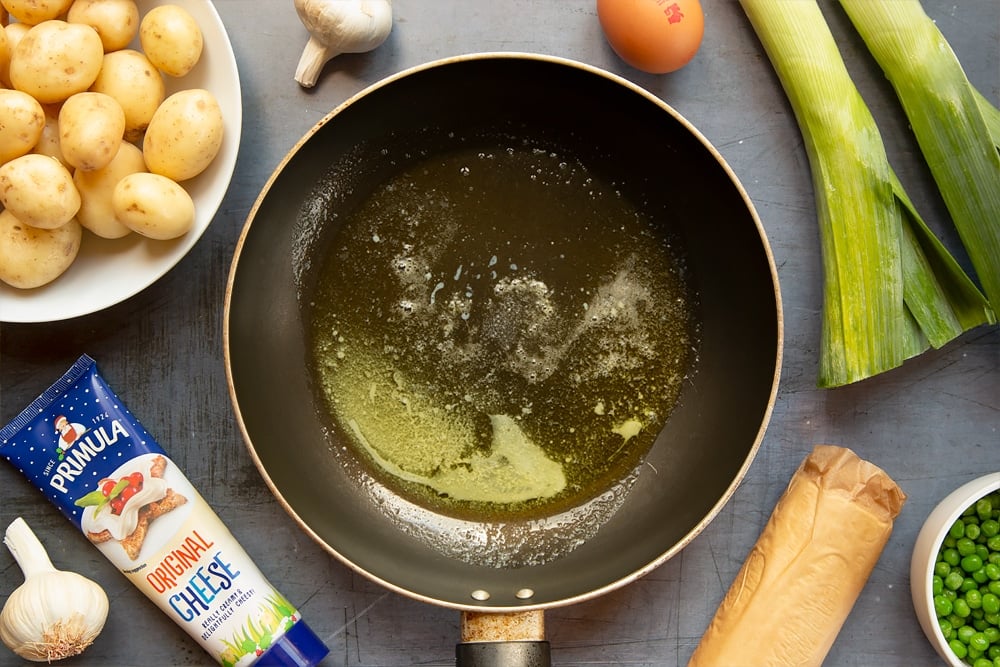 Butter melting in a frying pan over a low heat