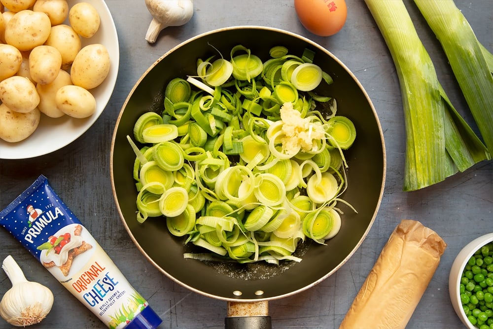 Leeks and garlic in a frying pan with butter