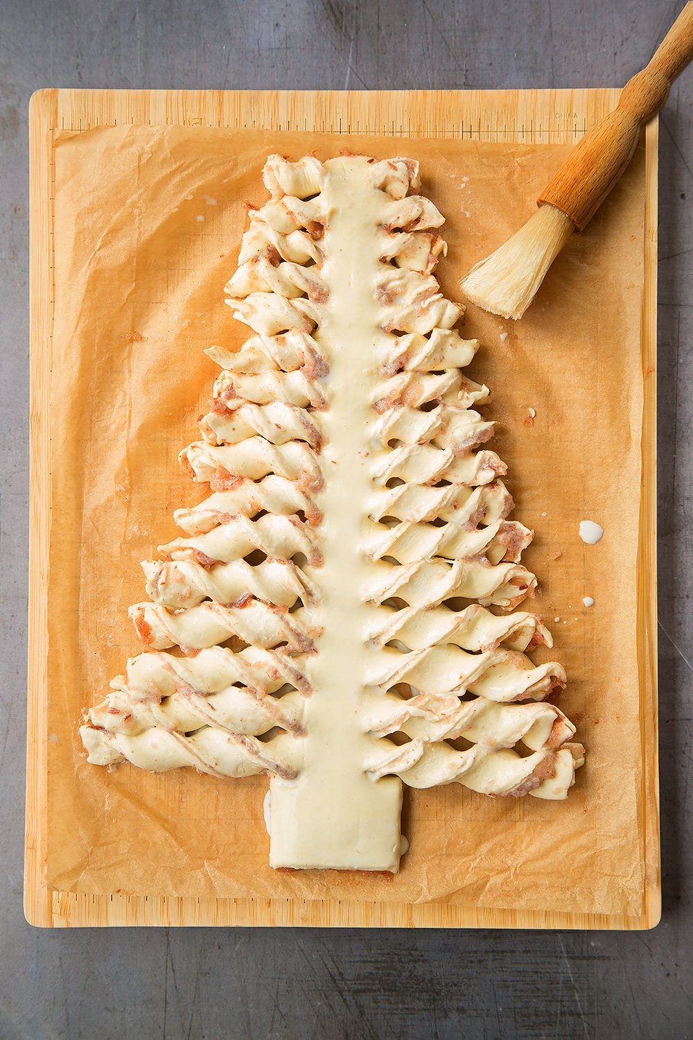 Brush your puff pastry Christmas tree with milk