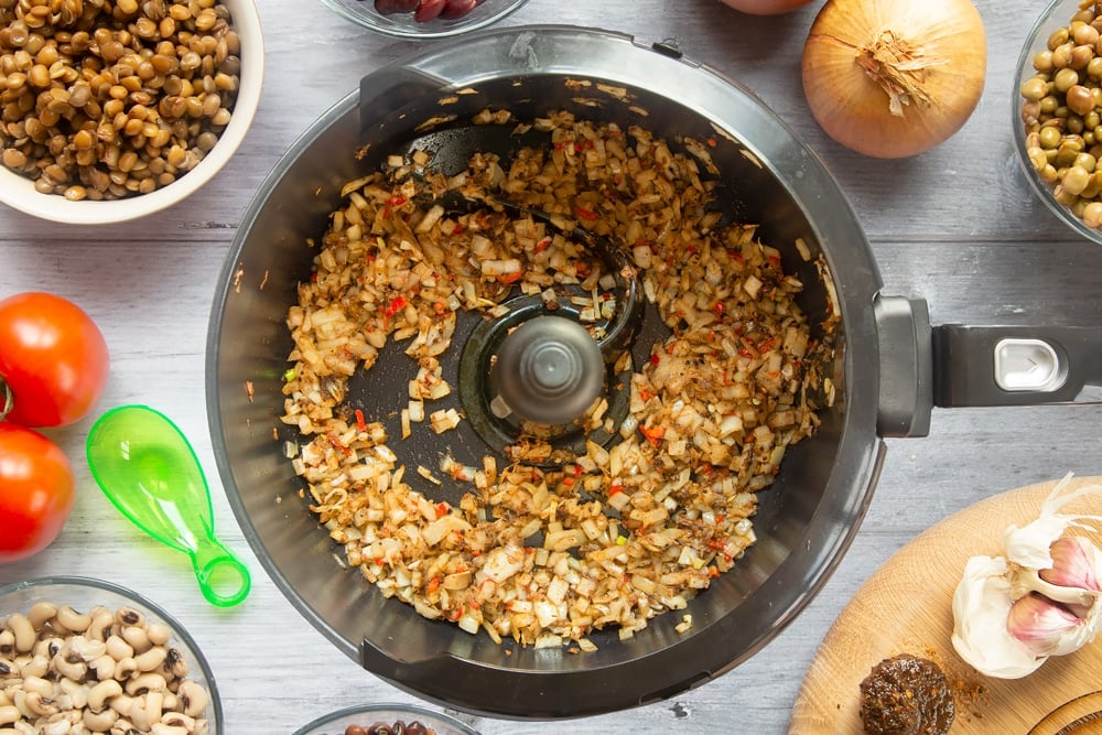 Oil, onion, garlic, chilli and jerk marinade cooking in the Actifry